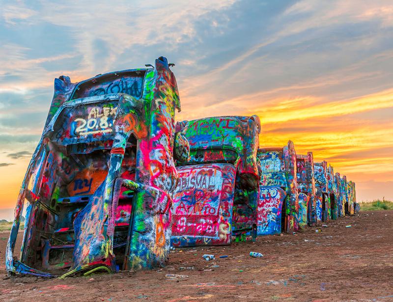 Spray paint to Cadillac Ranch